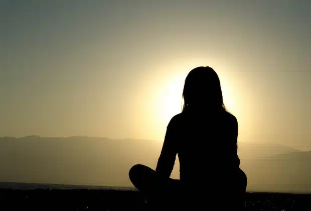 woman sitting on sand